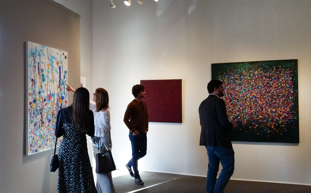 Art Stroll visitors viewing contemporary paintings at Reinike Gallery