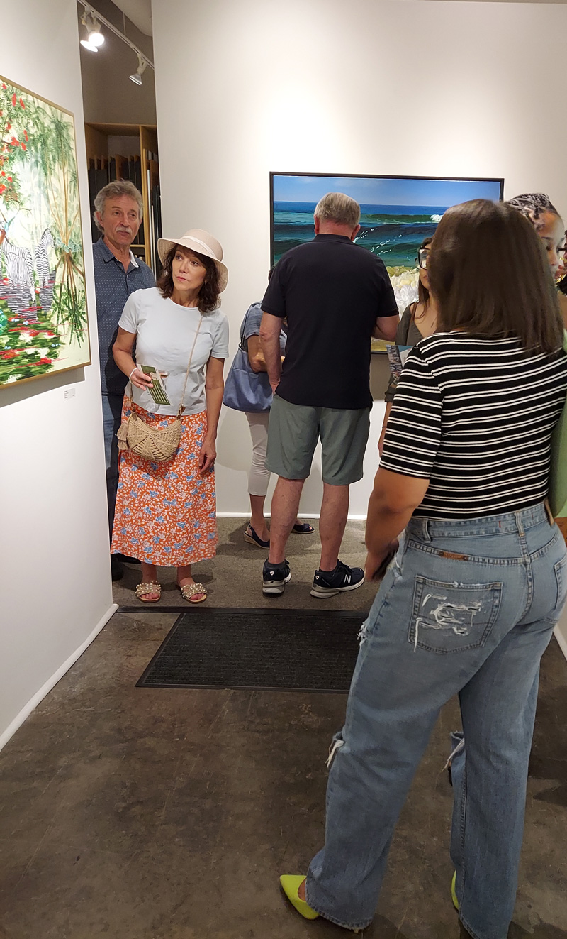 Guest looking around the corner at a painting