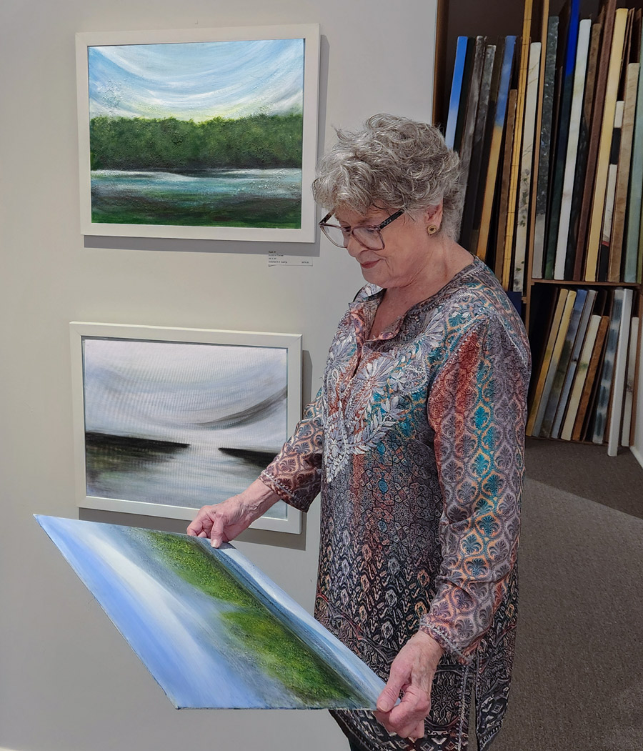 Gretchen R.R. Eppling holding Bayou Sara with Hush #7 and Vista hanging.