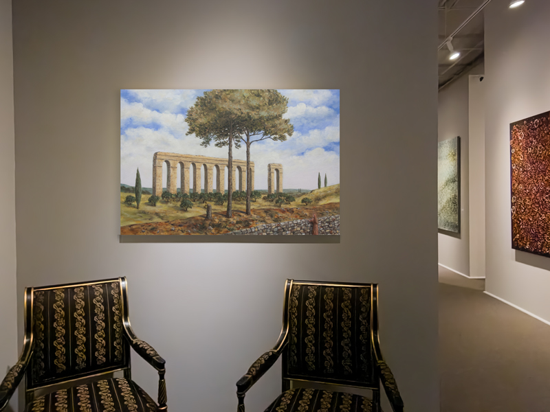 "Broken Dreams" hanging over chairs in Reinike Gallery